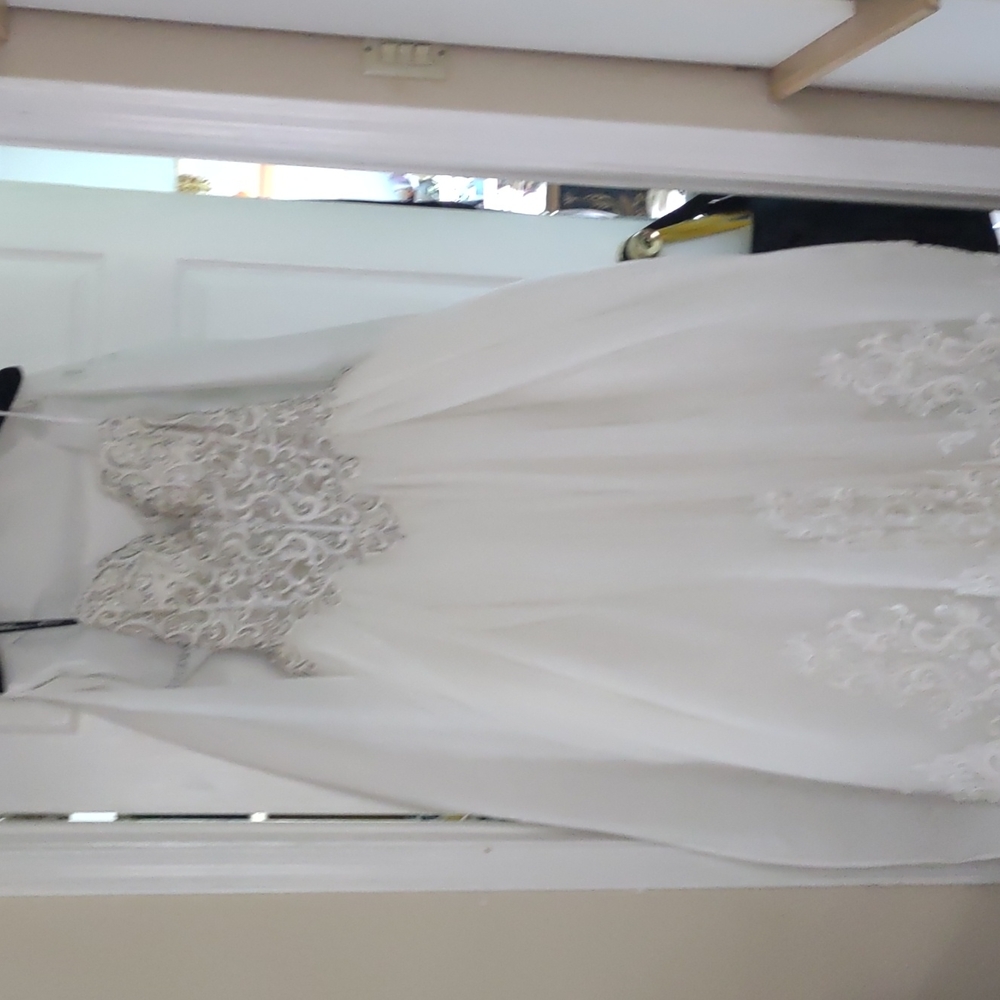 Size 8 hand beaded corset ball gown design by Ashley and Justin
